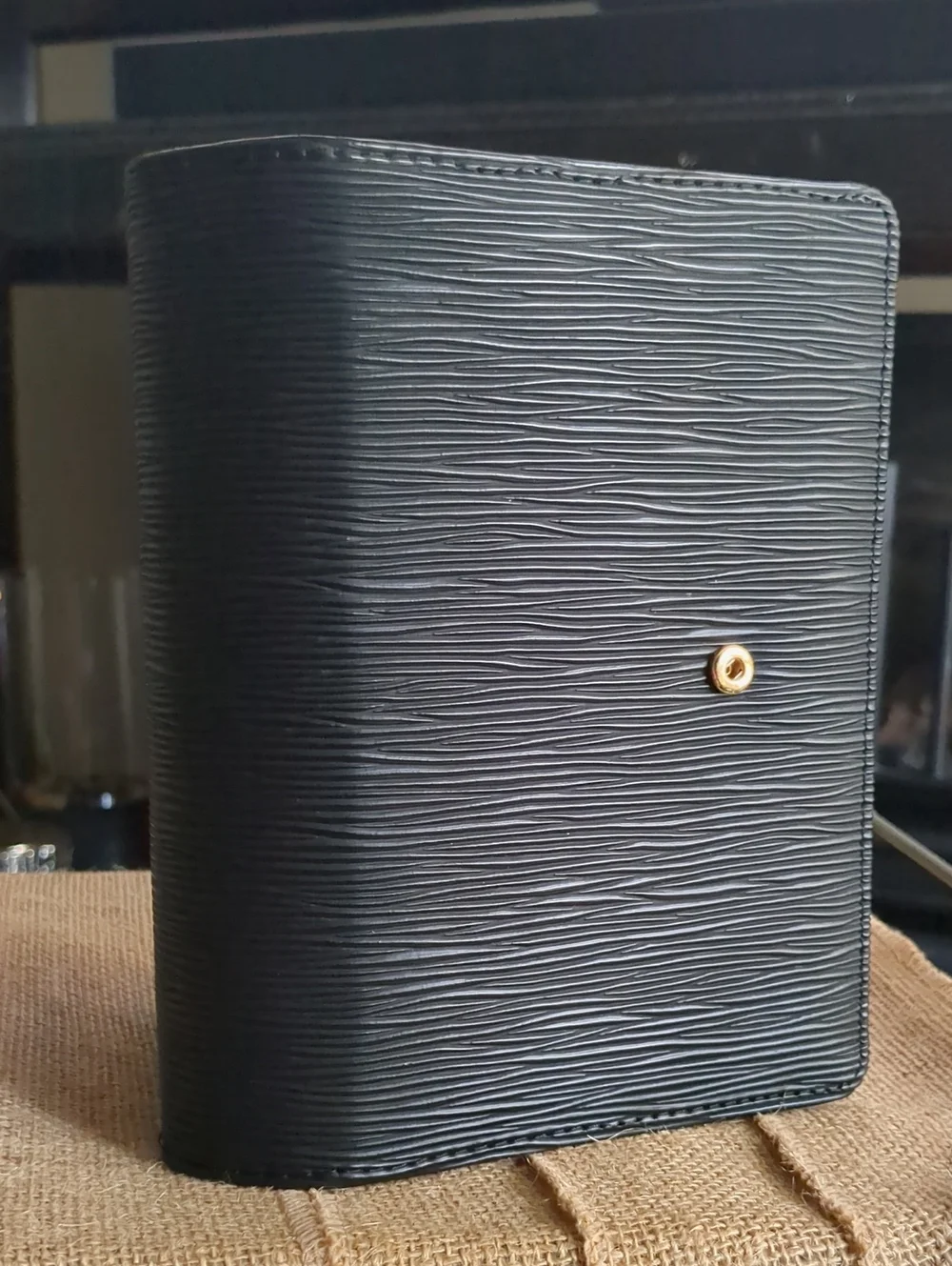 A6 Saffiano Binder In Black With Gold Hardware.